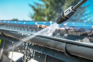 Gutters Cleaning Using Pressure Washer.